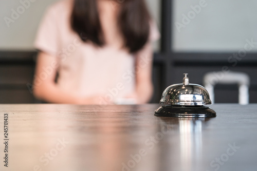 Hotel reception counter desk with service bell.