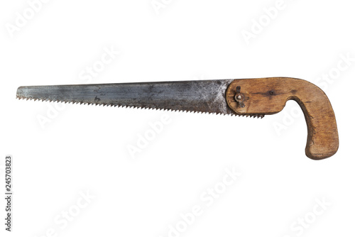 Rusty metal hand saw/ Rusty metal hand saw on wood isolated on white background photo