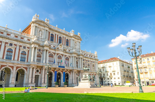 Turin, Italy, September 10, 2018: Facade of Palazzo Carignano palace Museum baroque rococo style old building on Piazza Carlo Alberto square, green lawn in historical centre of Torino city, Piedmont