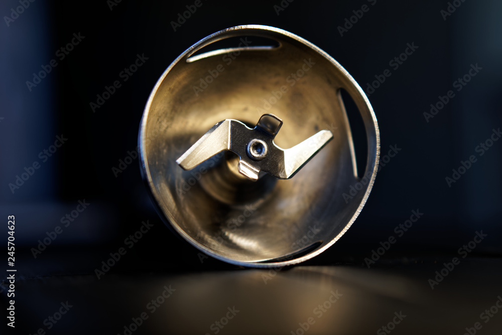 Rotating knife nozzle for blender on a dark background. Device for cooking
