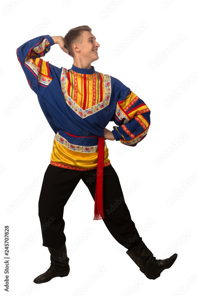 Attractive russian guy dancing in folk costume isolated on white Attractive russian guy dancing in folk costume isolated on white