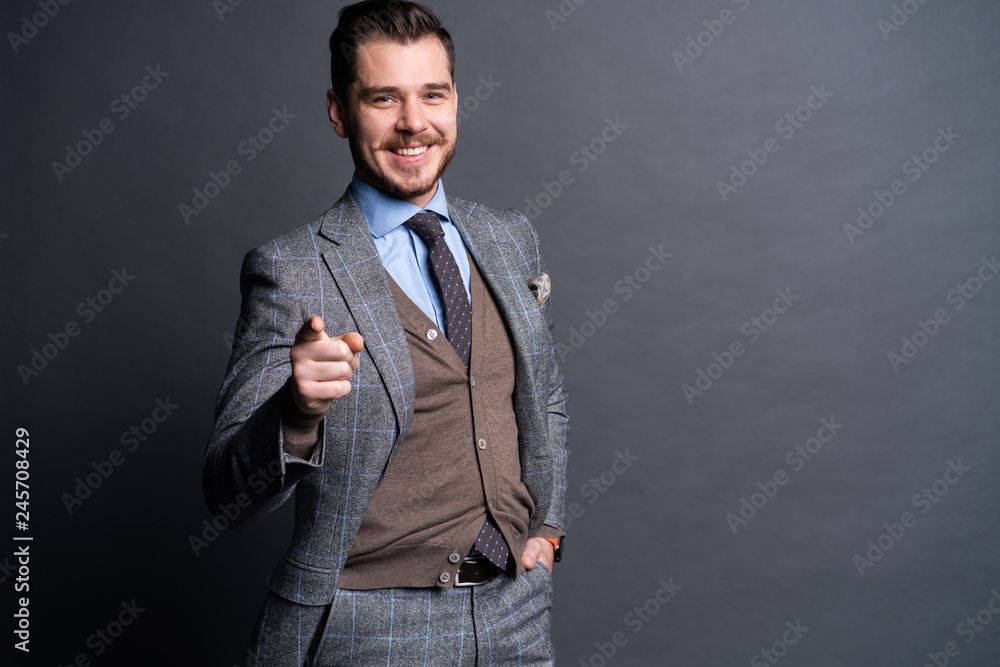 Portrait of young man pointing with his finger Portrait of young man pointing with his finger