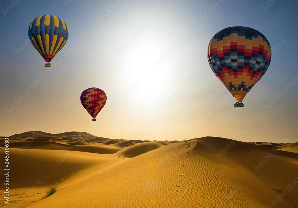 Fototapeta premium Desert and hot air balloon Landscape at Sunrise.