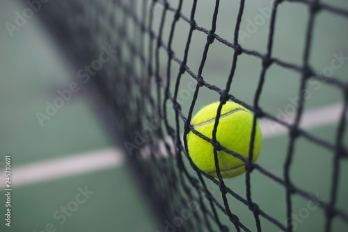 Close up tennis ball hitting to the net on court background with copy space © WK Stock Photo 