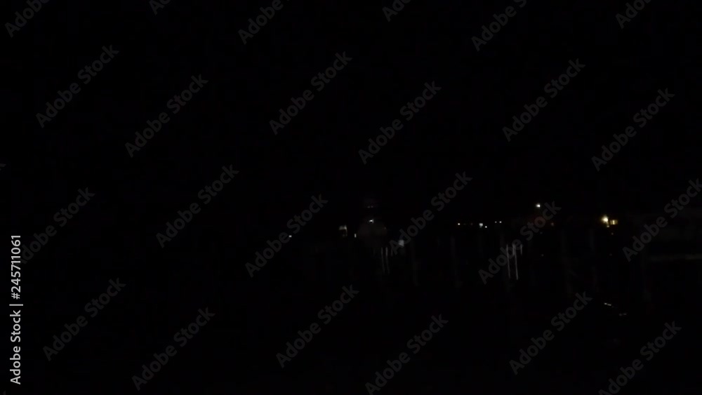 Heavy thunder lightning over ocean at night, light reveals boats in water. Heavy thunder lightning over ocean at night, light reveals boats in water.