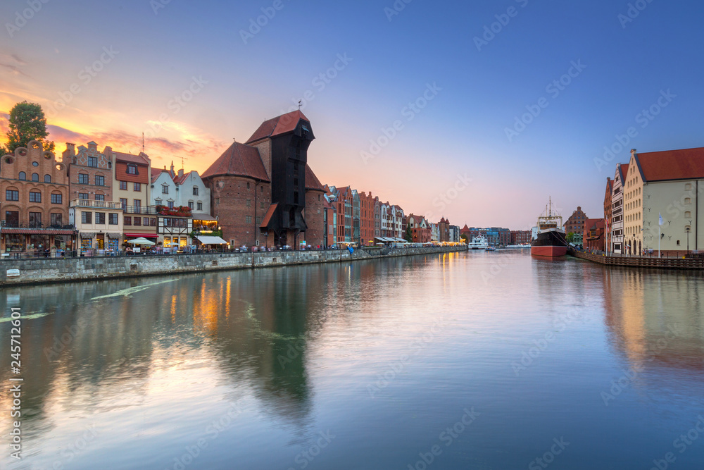 Old town of Gdansk reflected in Motlawa river at sunset, Poland