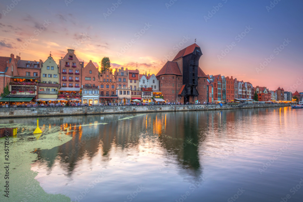 Old town of Gdansk reflected in Motlawa river at sunset, Poland