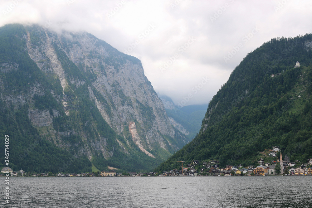 View idyllic Alpine mountains and lake in Hallstatt