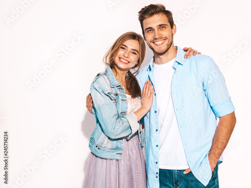 Portrait of Smiling Beautiful Girl and her Handsome Boyfriend laughing.Happy Cheerful Family.Valentine's Day. Isolated on white. Hugging