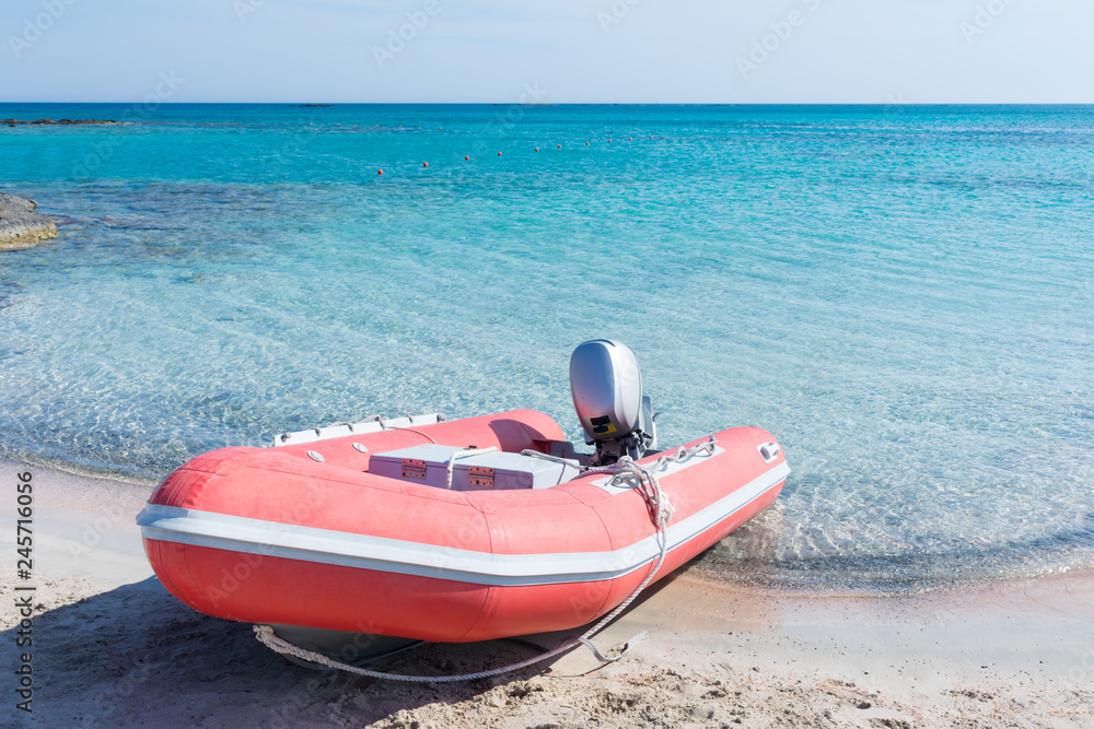 Inflatable boat at the beach on Elafonisi beach in Crete Inflatable boat at the beach on Elafonisi beach in Crete