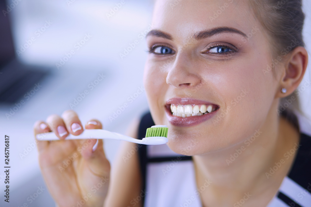 Young pretty girl maintaining oral hygiene with toothbrush. Young pretty girl maintaining oral hygiene with toothbrush.