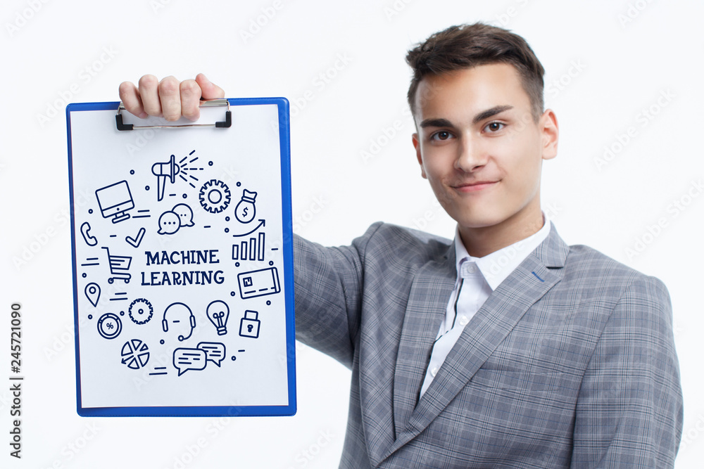Business, technology, internet and networking concept. Young entrepreneur showing keyword: Machine learning Business, technology, internet and networking concept. Young entrepreneur showing keyword: Machine learning