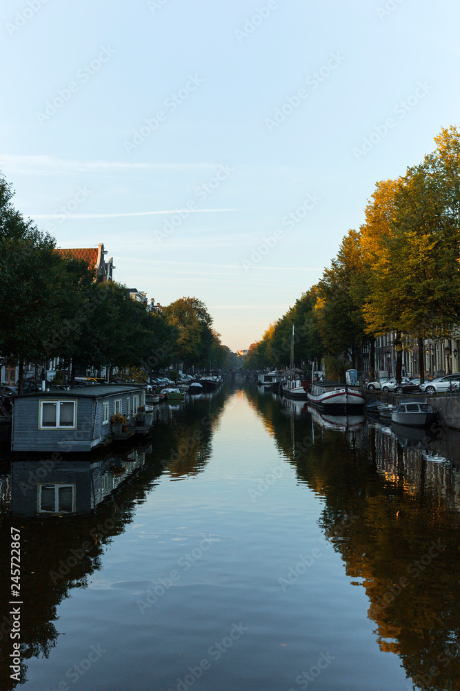 Classic dutch morning canal scenery during autumn.