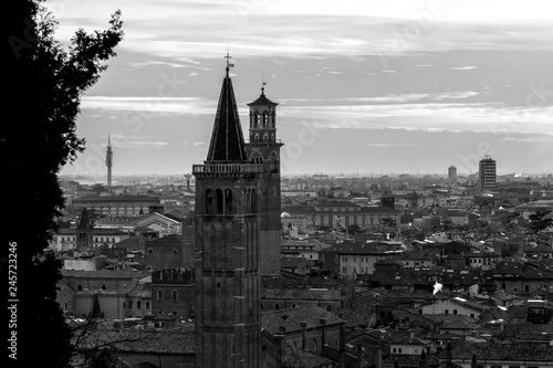 Veronese bell towers portrayed in black and white from the hills  among the elms on a beautiful winter day with a clear sky