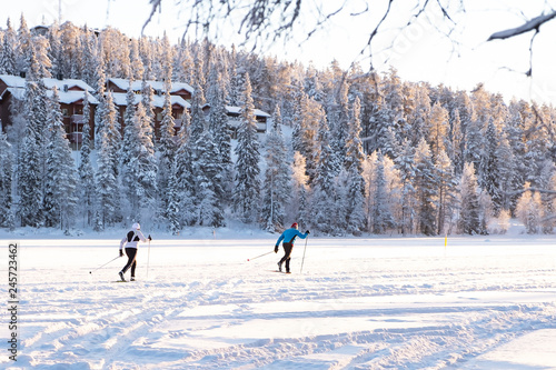 Photography Skiers runners glide through the snow