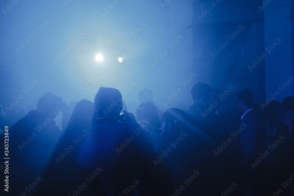 Silhouette of people at the party.