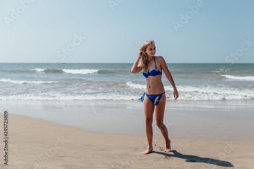 girl sunbathes on the ocean coast