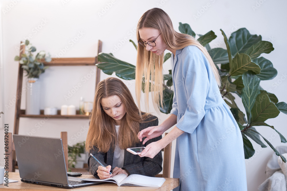 supervisor woman and subordinate woman discuss office work supervisor woman and subordinate woman discuss office work