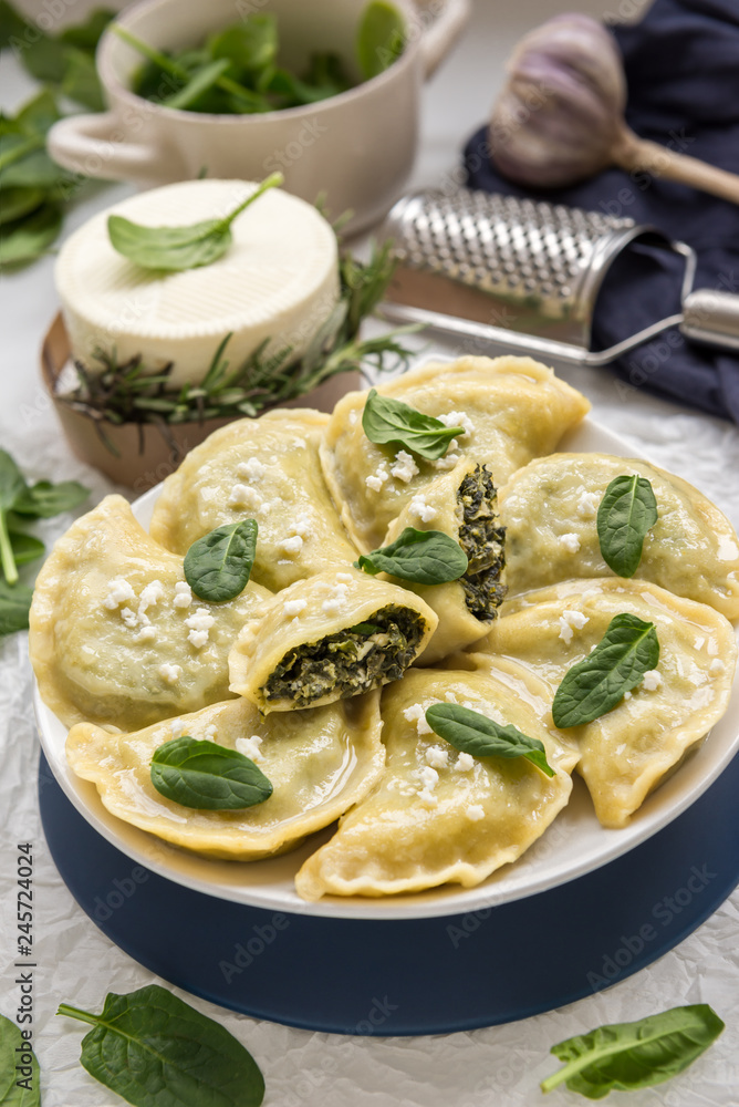 Dumplings with spinach and white cheese. This is a very popular food in Poland Dumplings with spinach and white cheese. This is a very popular food in Poland