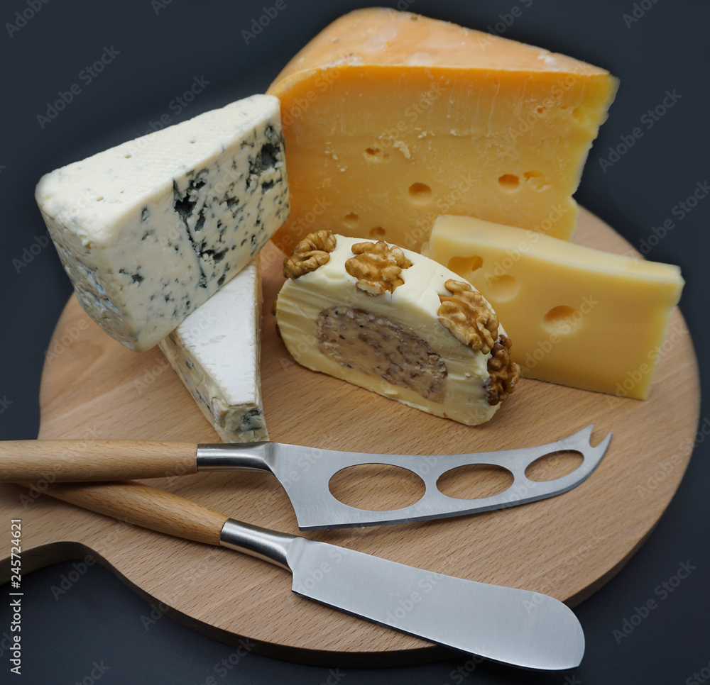 cheese selection on wooden rustic board. Various types of international cheese, blue mold, gouda, gorgonzola . top view - Image. 