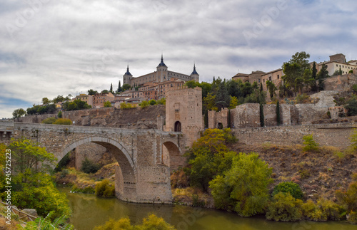 Alcantara bridge and view of the historic city of Toledo, Spain