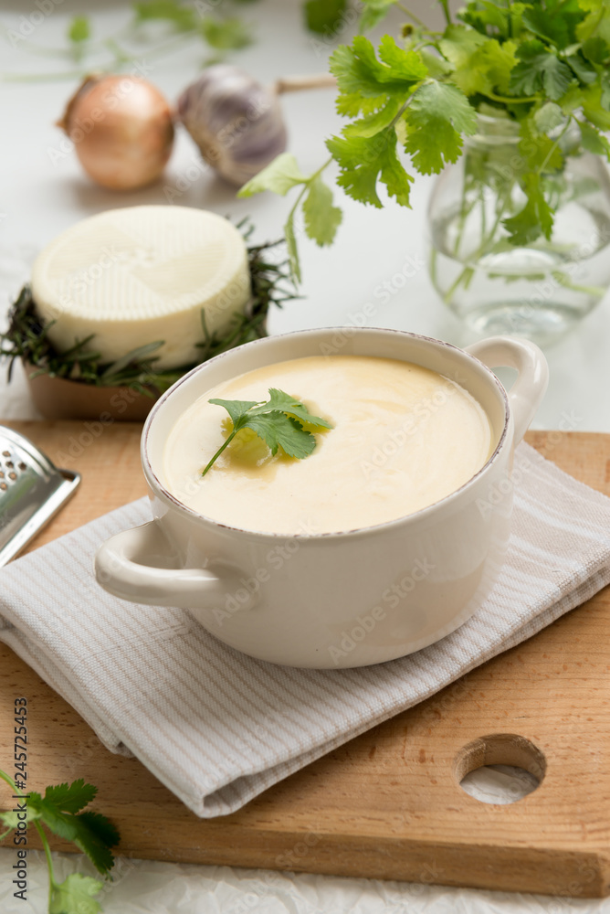 Cheese soup with yellow and white cheese, cream, onions and potatoes. Healthy Vegetarian Food