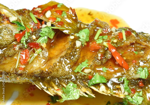 deep fried red banded grouper fish dressing sweet chili sauce on plate photo