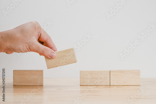 business finance. growing Profit concept,Hand arranging wood block