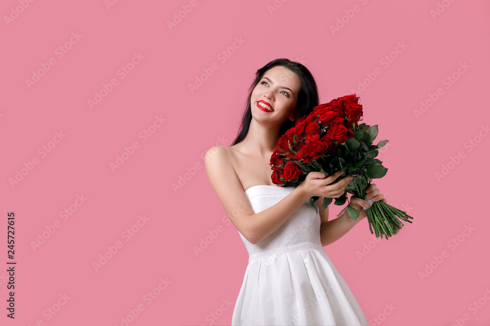 beautiful young woman with a large bouquet of red roses beautiful young woman with a large bouquet of red roses