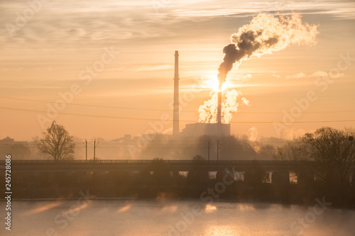 Thermal power plant in winter at sunrise