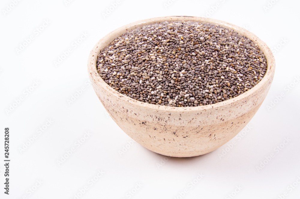 Chia seeds isolated on white background. A component of a healthy diet. Chia seeds isolated on white background. A component of a healthy diet.