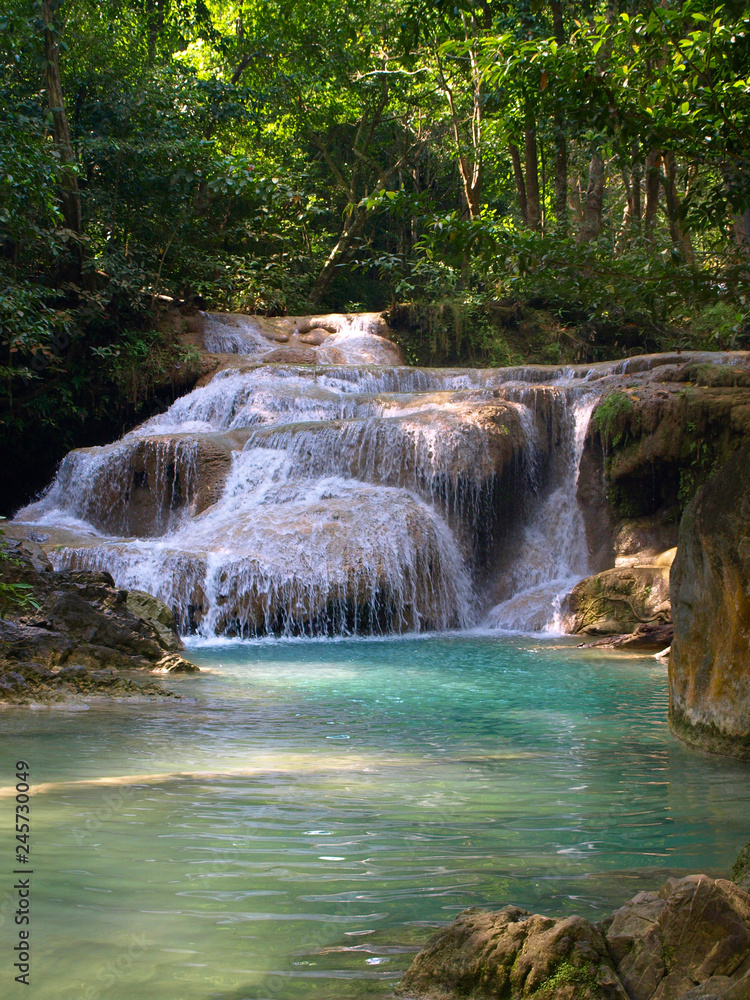 small cascading waterfall in the mountains of Thailand