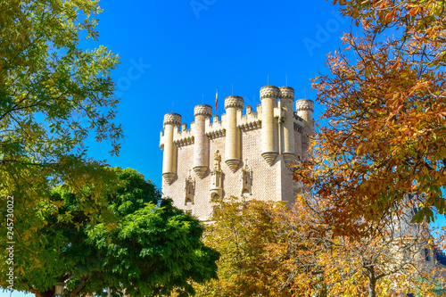 View of Alcazar tower among the trees during autumn, Segovia photo