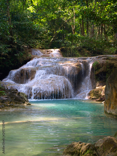 small cascading waterfall in the mountains of Thailand