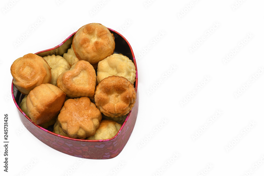 Isolate. Valentine's day. The heart-shaped box has a lot of cupcakes, cookies. Horizontal photography. Isolate. Valentine's day. The heart-shaped box has a lot of cupcakes, cookies. Horizontal photography.
