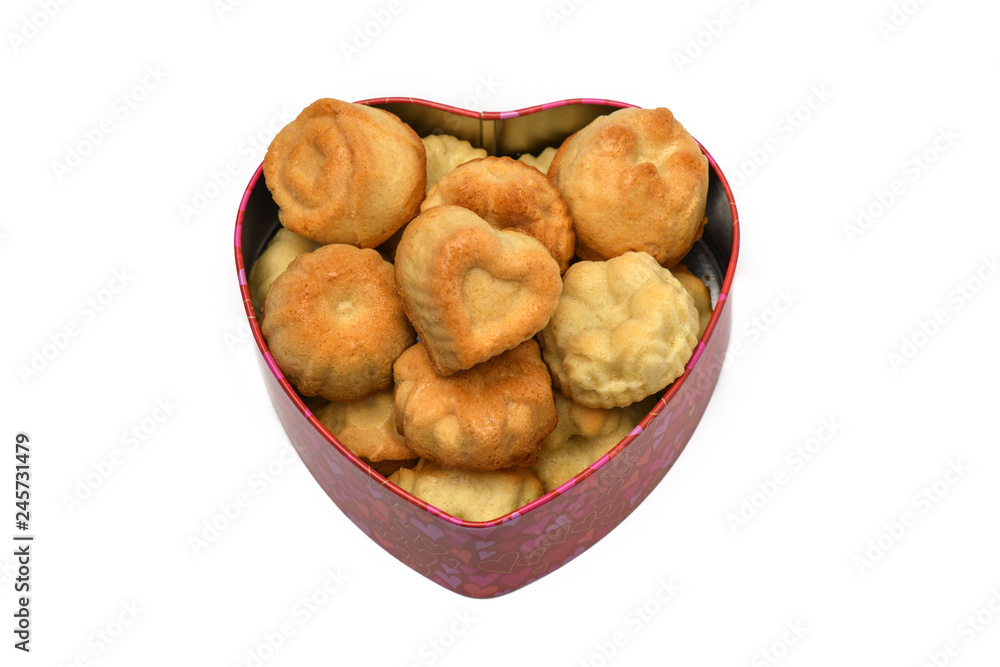 Isolate. Valentine's day. The heart-shaped box has a lot of cupcakes, cookies. Horizontal photography. Isolate. Valentine's day. The heart-shaped box has a lot of cupcakes, cookies. Horizontal photography.