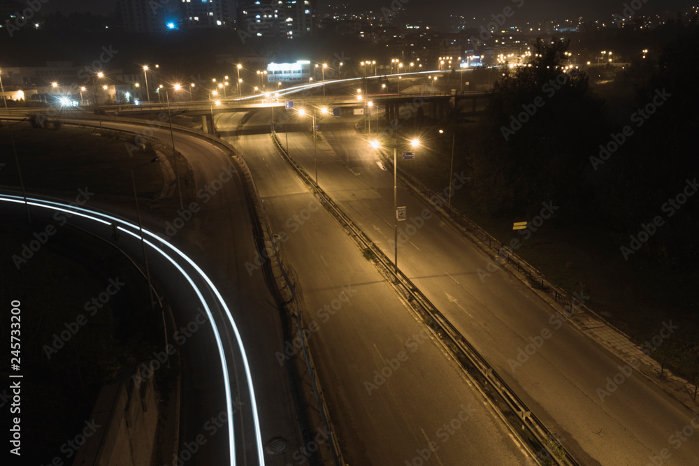 Autumn night light trails at entrance of the city. Autumn night light trails at entrance of the city.
