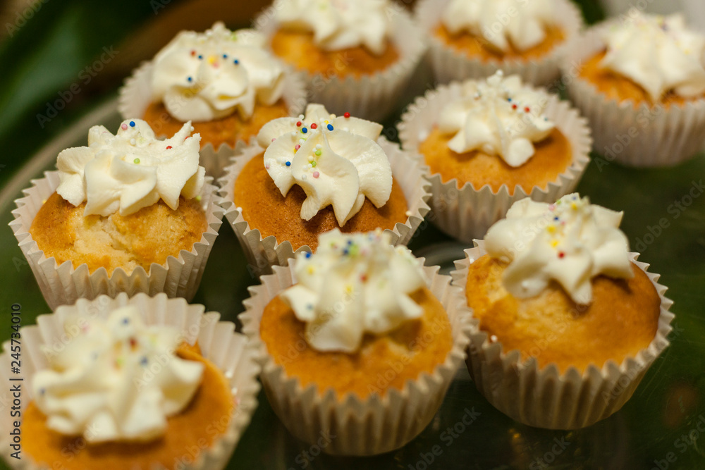Bakery. Stock of Muffins covered with cream. Bakery. Stock of Muffins covered with cream.