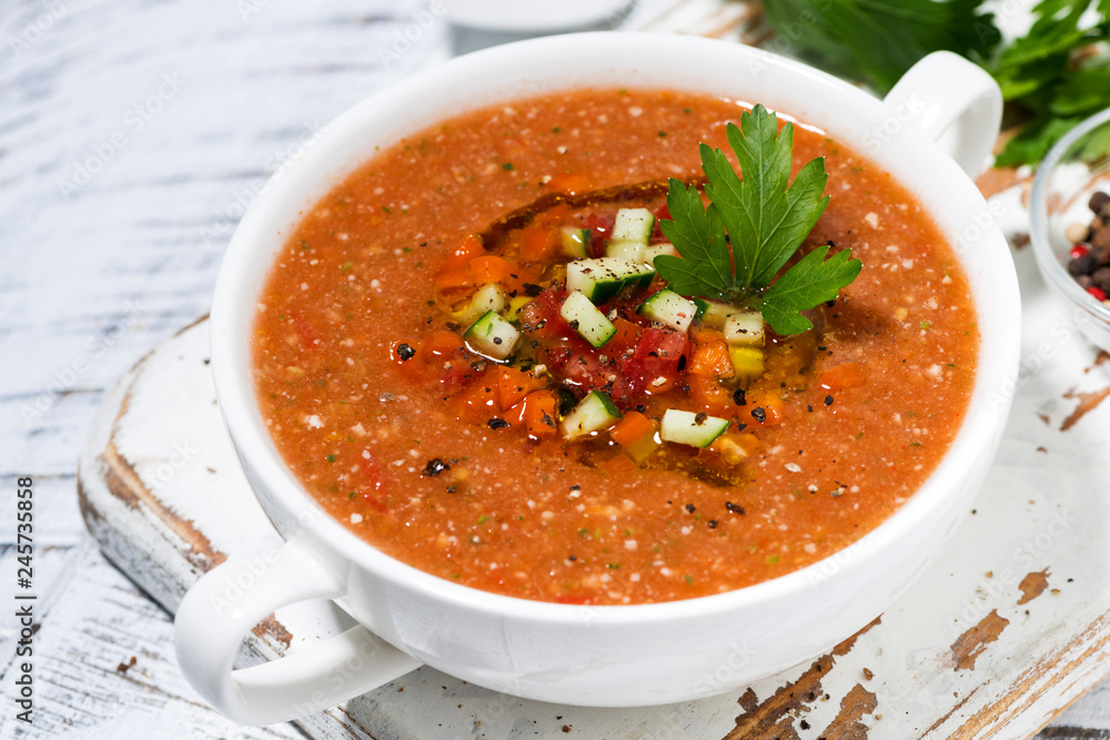 cold tomato soup in a bowl, closeup cold tomato soup in a bowl, closeup