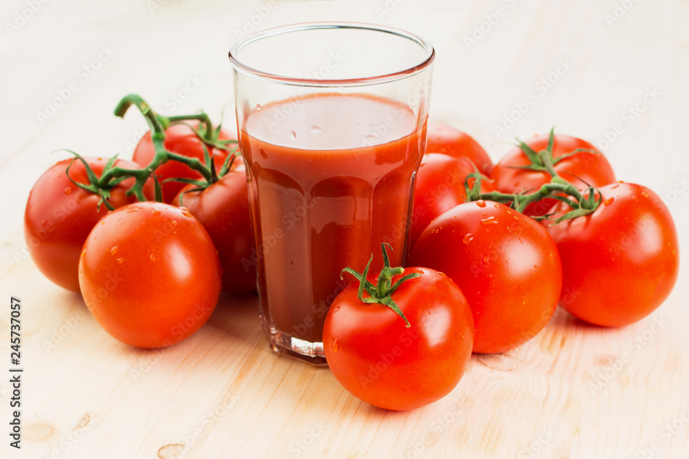 Glass of tomato juice with tomatoes Glass of tomato juice with tomatoes