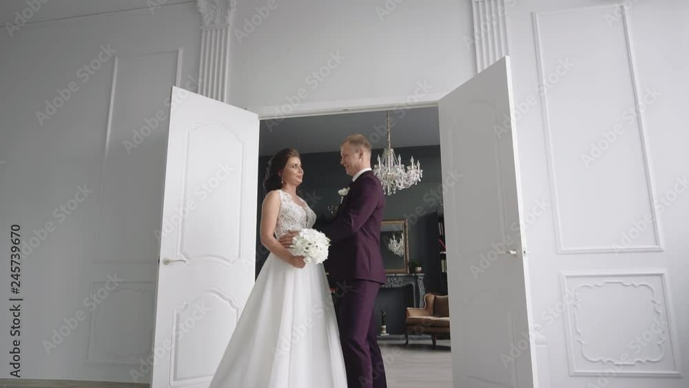 young couple in love man and woman in a wedding dress in the interior young couple in love man and woman in a wedding dress in the interior