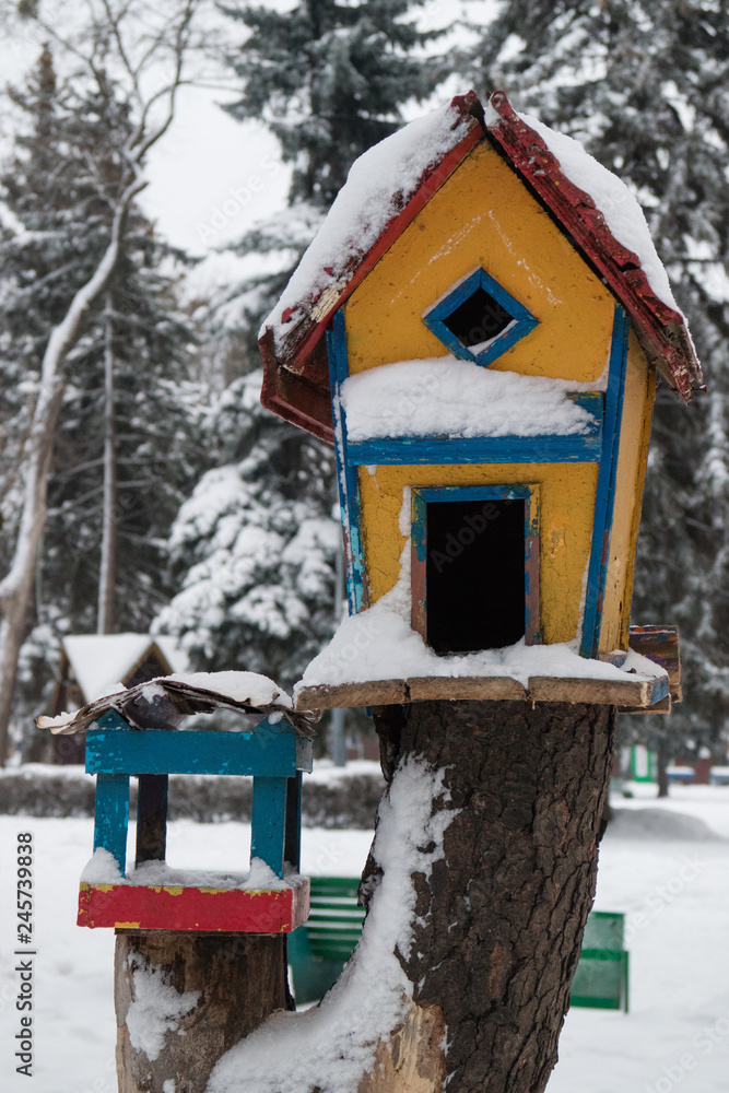 wooden birdhouse in the snow wooden birdhouse in the snow