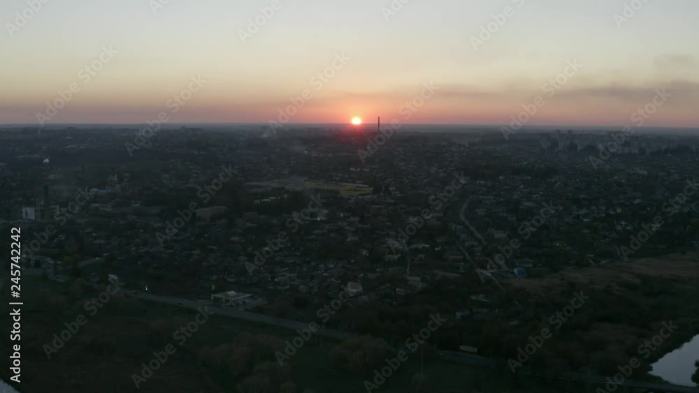 Aerial view. Silhouettes of buildings against the sky at sunset. Sunset over the city. Aerial view. Silhouettes of buildings against the sky at sunset. Sunset over the city.