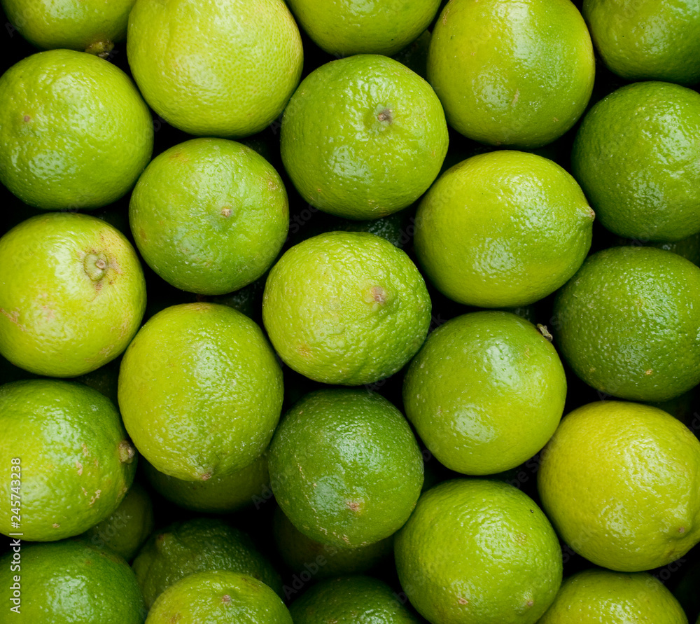 Lime Citrus Fruits, green and yellow, at the local farmer market, Milan, Italy Lime Citrus Fruits, green and yellow, at the local farmer market, Milan, Italy