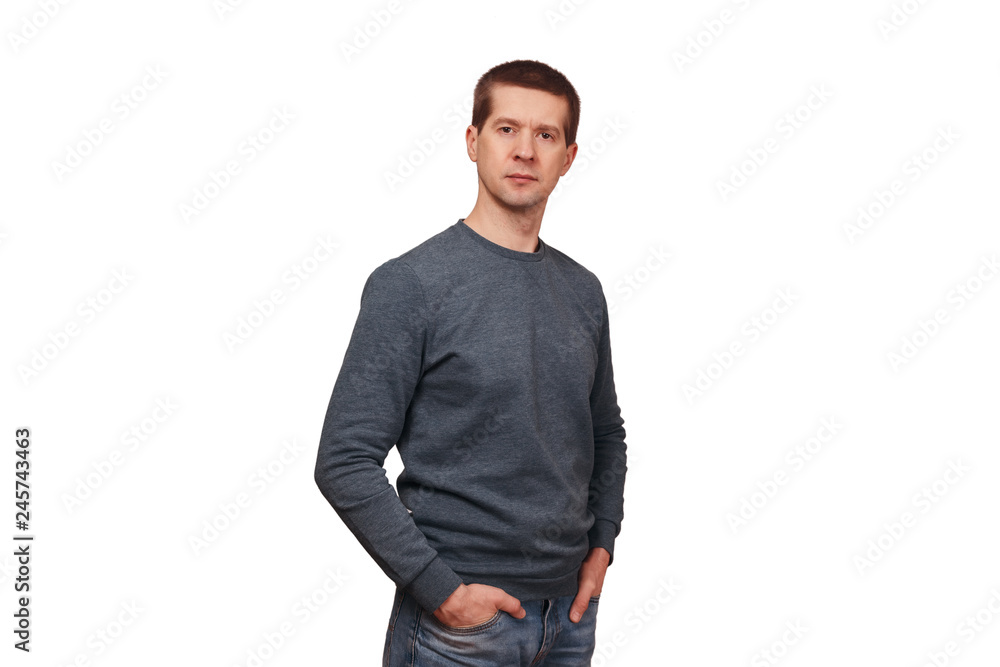 The adult man in long sleeved t-shirt and jeans The adult man in long sleeved t-shirt and jeans