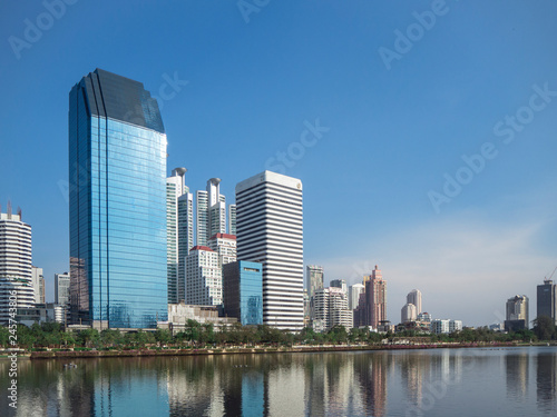 view of cityscape and pond of Benjakiti park, Bangkok, Thailand © DrKlum