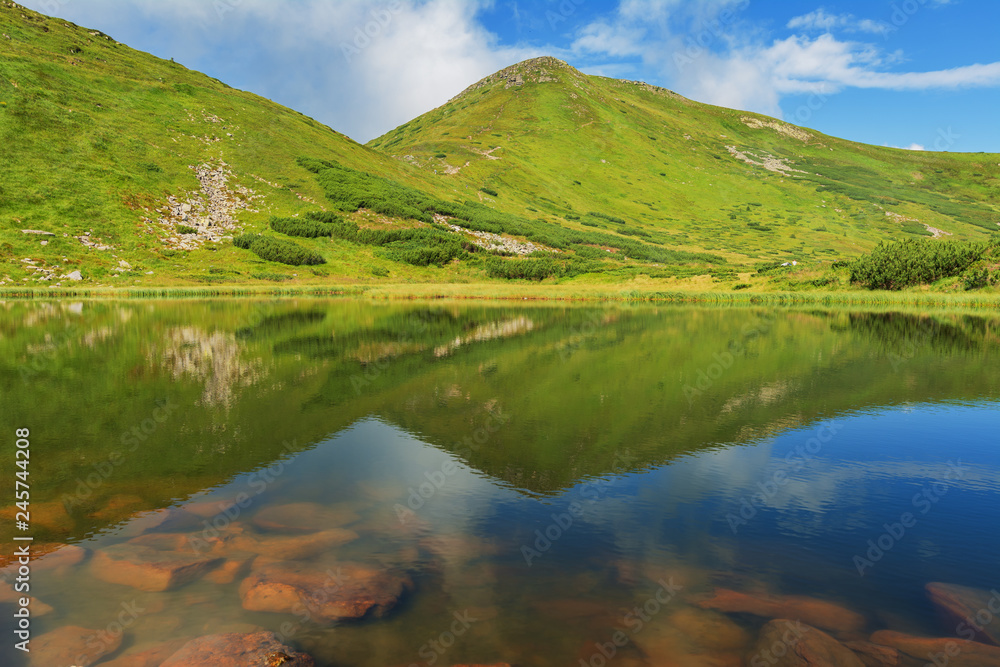 Landscape with mountain lakes in the Ukrainian Carpathians during the summer season.