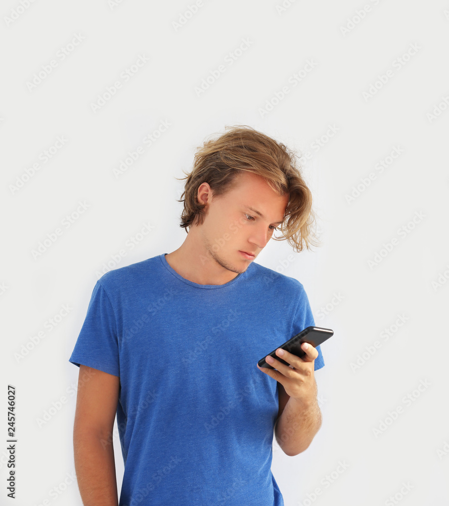 Teenage boy typing text message.Using smart phone. Teenage boy typing text message.Using smart phone.