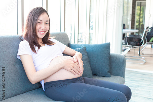 Free Download Beauty Pregnant relaxing after exercise workout during pregnancy. - GFXLoad