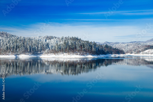 Gorski kotar, Lokvarsko lake in Croatia, beautiful mountain landscape in winter, forest reflecting in the water  photo